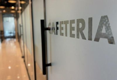 Frosted glass door leading to the office cafeteria area.