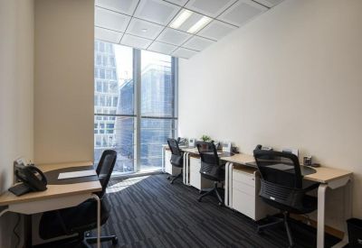 Four-person private office suite with large windows and ergonomic chairs.