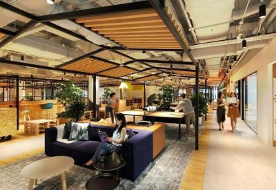 Lounge area with a navy sofa, wooden trellis ceilings, and people playing ping pong.