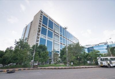 Exterior view of the glass-facade Rupa Solitaire building in Millennium Business Park.