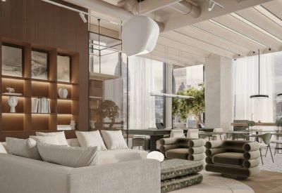 Cozy office lounge with bookshelf and modern seating.