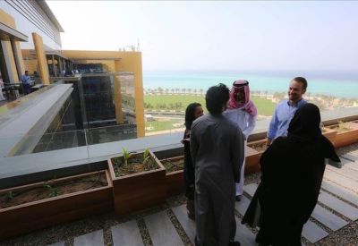 Breakout area on a terrace with outdoor seating and coastal views.