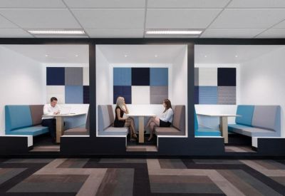 Modern semi-private meeting booths with blue and grey upholstery.