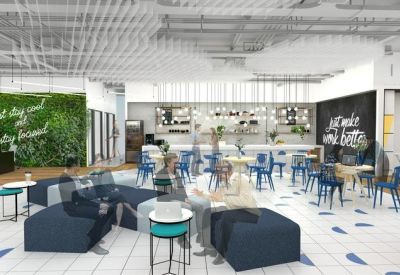 Large communal breakout area with blue seating and a decorative ceiling.