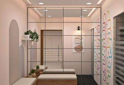 Entryway lounge with wooden benches and colourful wall art.