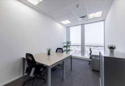 Bright private office suite for two with large windows.