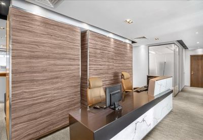 Reception area featuring a wood-paneled feature wall and a sleek dark wood desk.