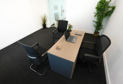 Top view of a simple office setup with plants.