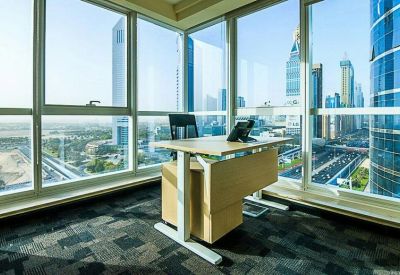 Bright corner office suite with floor-to-ceiling windows overlooking a dense city skyline.