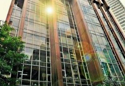 Exterior view of the brown-tinted glass facade of Finman Building.