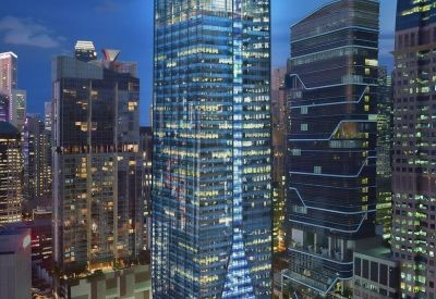 Evening exterior view of the glowing glass-facade at Fraser Tower, 182 Cecil Street.