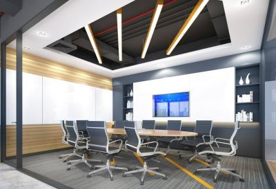 Modern conference room with high-backed chairs and a backlit display wall.