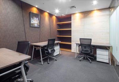 Private office suite featuring dark textured walls and three wooden desks.