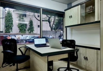Private office with two workstations and a window view at Girish, 1156, Shukrawar Peth, Pune - 411002.