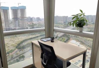 Private window office with a single desk and panoramic city views.