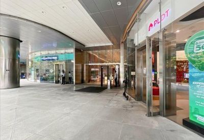 Lobby area with glass storefronts and polished flooring.