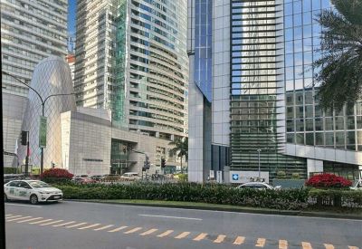 Modern street level view of glass office buildings and pedestrian walkways.
