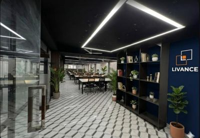 Sleek hallway with geometric floor tiles and branded dark blue feature wall.