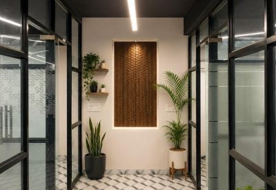 Modern corridor with floor-to-ceiling glass partitions and wood-paneled accents.