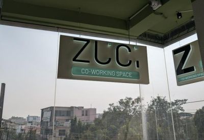 Branded glass signage for the co-working space entrance.