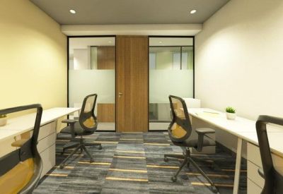 Private four-person office suite with white desks and ergonomic mesh chairs.
