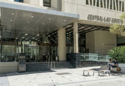 Private office with two desks and large window.