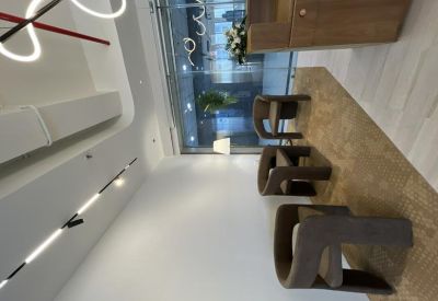 Comfortable lounge area with modern brown chairs and warm wood accents.