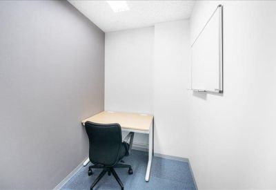 Small office with a single desk and chair.