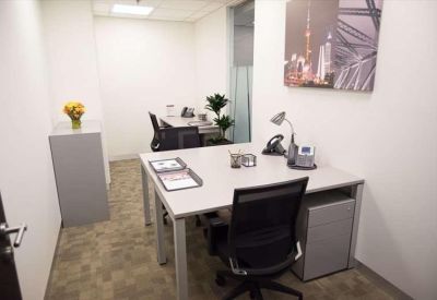 Small private office with minimalist decor and two chairs.