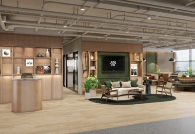 Spacious reception area with curved wooden desk and built-in shelving.