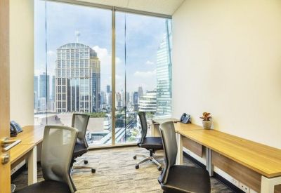 Four-person private office with wooden desks and a large window overlooking the Bangkok skyline.