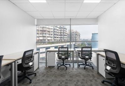 Bright four-person private office suite with large windows and city views.
