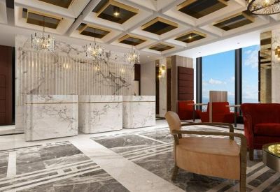 Opulent reception area with marble desks, patterned floors, and ornate ceiling details.