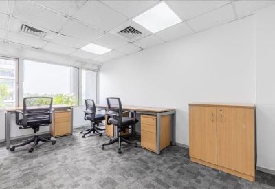 Bright private office suite featuring three ergonomic chairs and light wood desks.