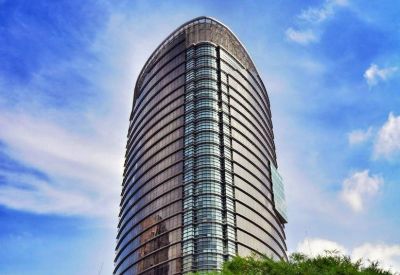 Exterior view of the curved glass facade of The Gardens North Tower in Mid Valley City.