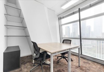Private office suite with glass shelving and large windows overlooking the city skyline.