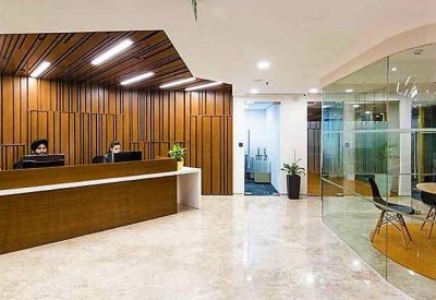 Reception area with a wooden feature wall and marble flooring.