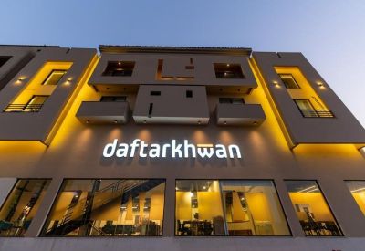 Exterior view of the modern daftarkhwan building at Plot No# C30, Sector F, DHA Phase 1 with warm evening lighting.