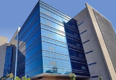 Exterior facade of the blue glass and stone Redbrick Offices, Kalpataru, Wagle Estate.