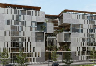 Wide exterior shot showing the building's interconnected blocks and green terraces.