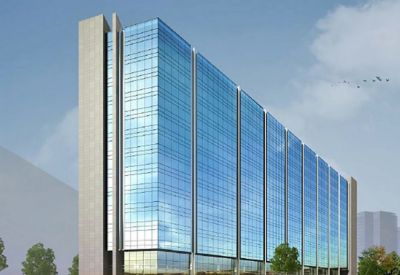 Architectural rendering of a glass-walled high-rise building with a sleek blue finish.