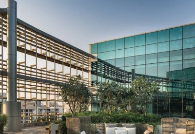 Rooftop terrace with lounge seating and greenery at Redbrick Offices, Solitaire Corporate Park Building N.