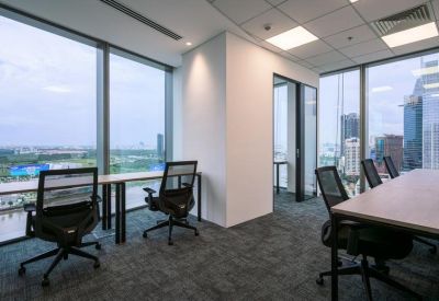 Corner office space with two desks and expansive window views.