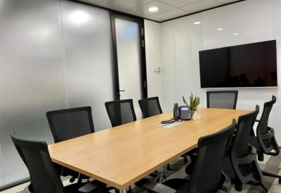 Spacious boardroom with wooden table and video conferencing screen, Tsim Sha Tsui, Hong Kong