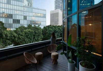 Private outdoor terrace with seating and city views.