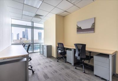 Private office with four workstations and expansive city views.