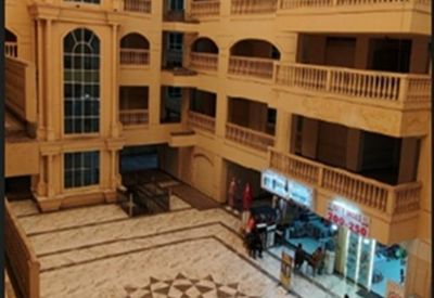 Atrium view of SF 2066 NAZARBAUG PALACE with multi-level arched balconies and a patterned marble floor.