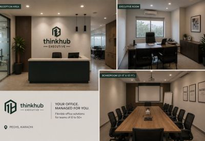 Spacious boardroom with a long wooden table, black mesh chairs, and a projector screen.