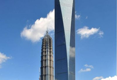 Exterior view of the iconic Shanghai World Financial Tower with its distinctive trapezoidal aperture.