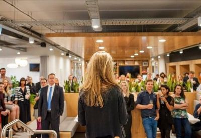 Wide-angle view of a conference or event with attendees.